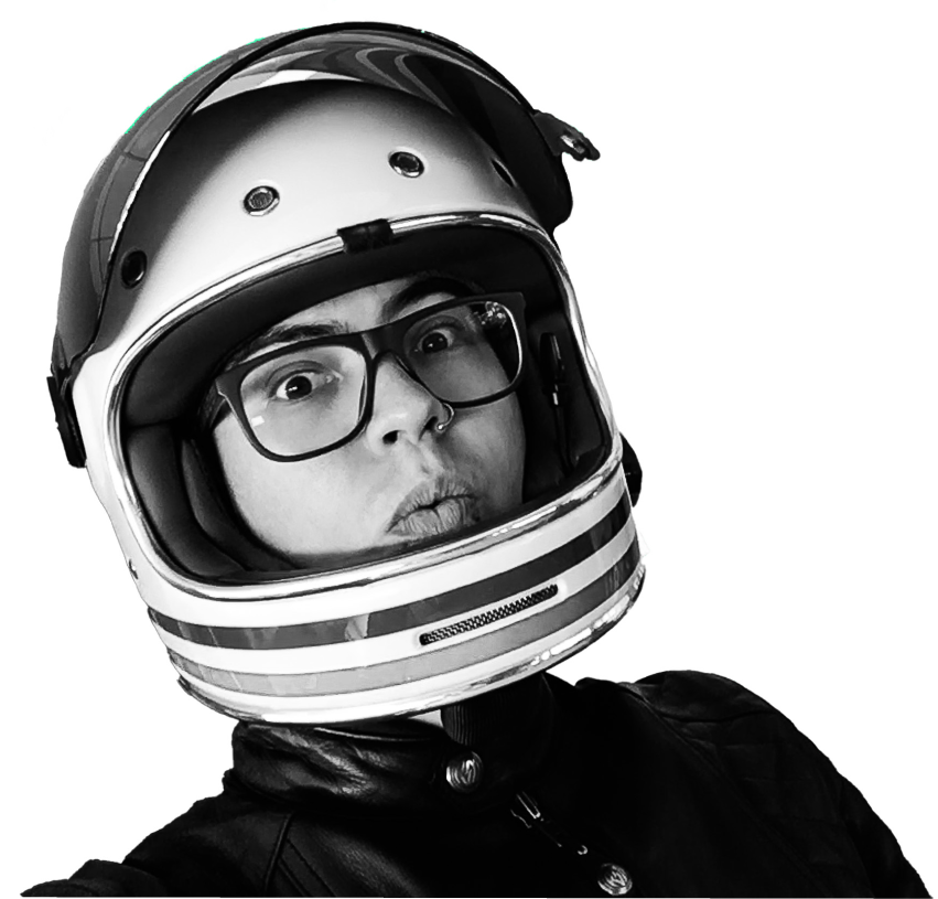 Vega Li wearing a motorcycle helmet and looking playfully at the camera
